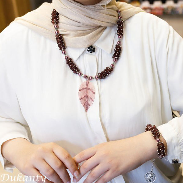 طقم نيروز - كريستال وأحجار الهيماتيت مع قلادة زركون