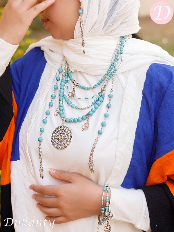 Turquoise necklace with metal pendants